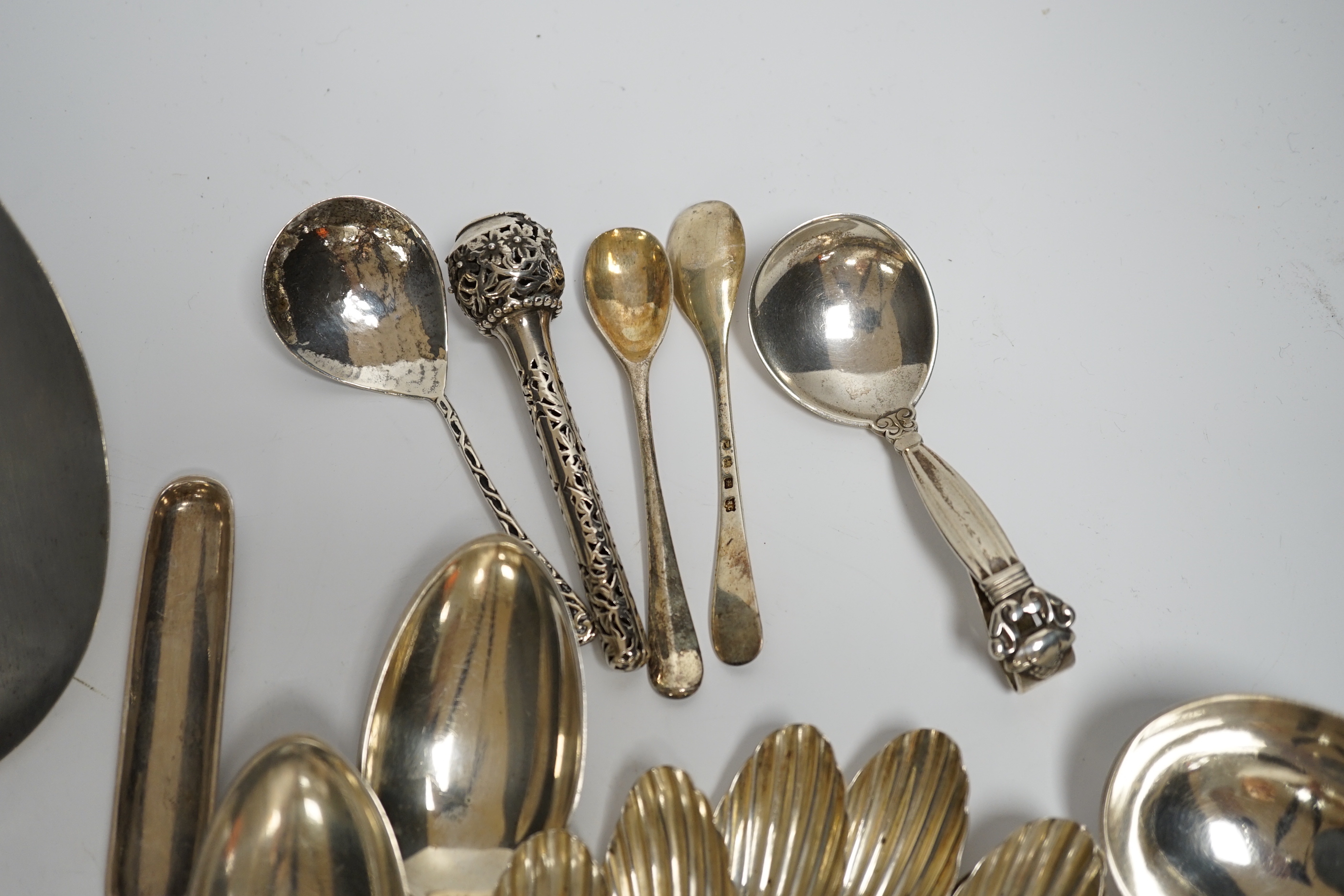 An early to mid 20th century Georg Jensen sterling and hardwood server, 26.1cm and a similar caddy spoon, together with other silver flatware, Scandinavian flatware and a plated marrow scoop.